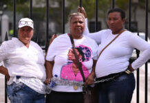 Residents Chain Themselves to Parliament Gates, Demand Action on Gang Violence