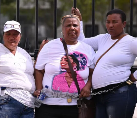 Residents Chain Themselves to Parliament Gates, Demand Action on Gang Violence