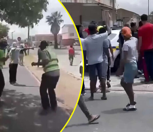Gang members and police gunfire exchange: All hell breaks loose in Manenberg as residents bay for Police officers' blood (WATCH VIDEOS)