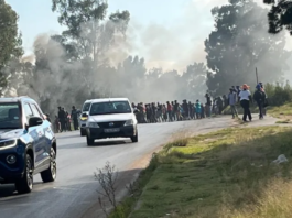 Burning tyres and blocked roads: Transport operators stop work over months of unpaid fees