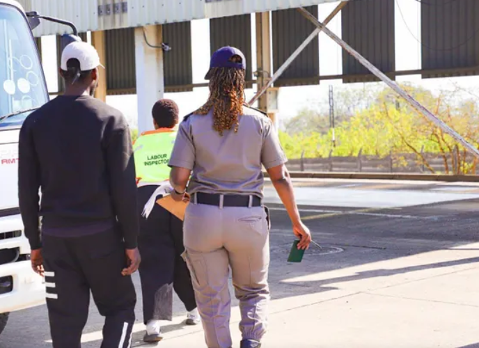 Female-officers-arrest-foreigner