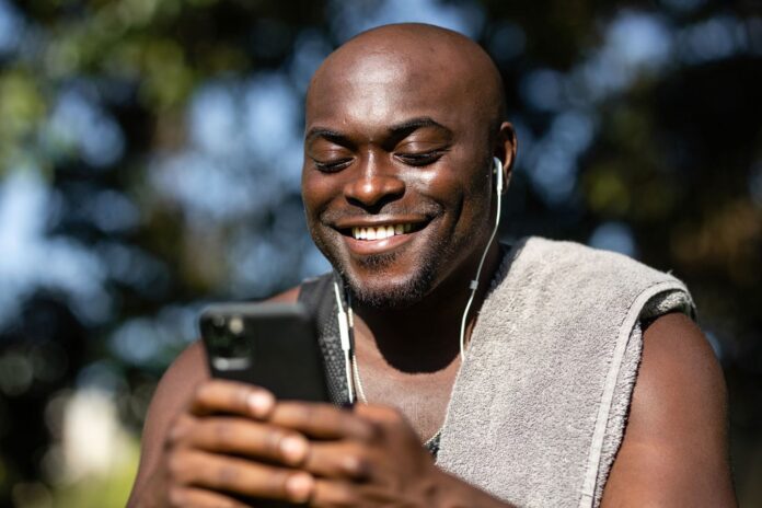 Man listening to music on cellphone entertainment